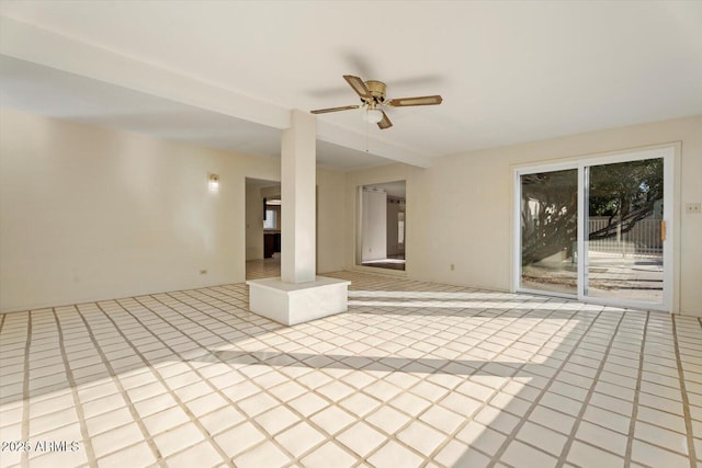 interior space with ceiling fan