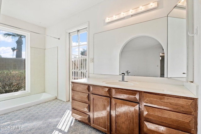 bathroom featuring shower / tub combination and vanity