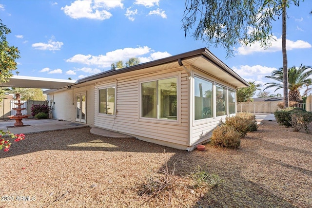 view of side of home featuring a patio