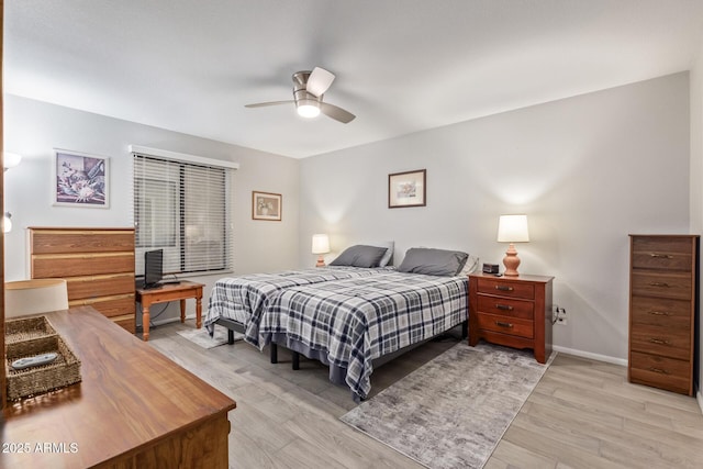 bedroom featuring ceiling fan and light wood-type flooring