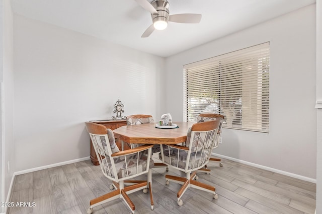 dining area featuring ceiling fan and light wood-type flooring