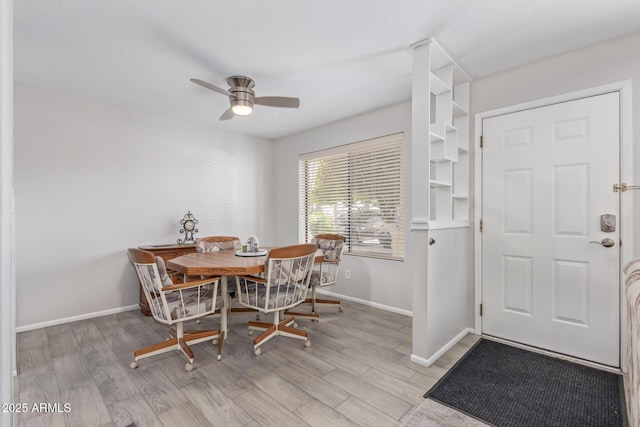 dining area featuring light hardwood / wood-style floors and ceiling fan