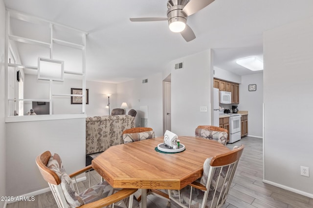 dining space featuring ceiling fan and light hardwood / wood-style floors