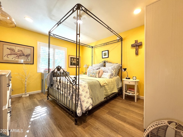 4554 E Paradise Village Pkwy N Unit 133, Phoenix, AZ 85032 - bedroom featuring wood finished floors and recessed lighting