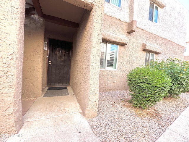 4554 E Paradise Village Pkwy N Unit 133, Phoenix, AZ 85032 - doorway to property featuring stucco siding