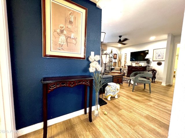 4554 E Paradise Village Pkwy N Unit 133, Phoenix, AZ 85032 - living area with wood finished floors, ceiling fan, and a textured wall