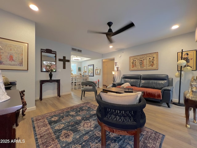 4554 E Paradise Village Pkwy N Unit 133, Phoenix, AZ 85032 - living room featuring a ceiling fan, light wood-style floors, and recessed lighting