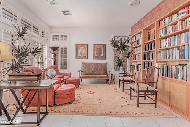 living area with recessed lighting, tile patterned floors, and visible vents