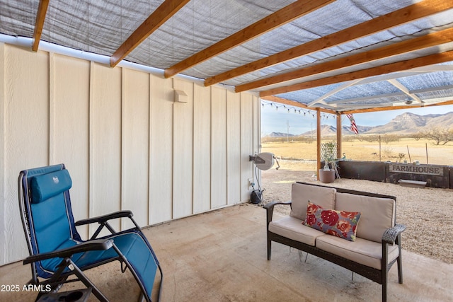 view of patio featuring a mountain view and a pergola