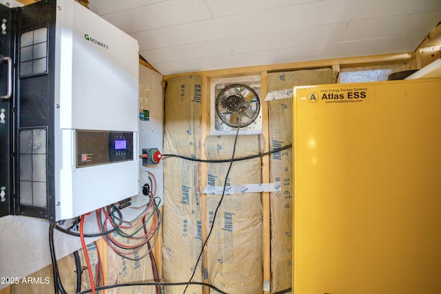 utility room with tankless water heater