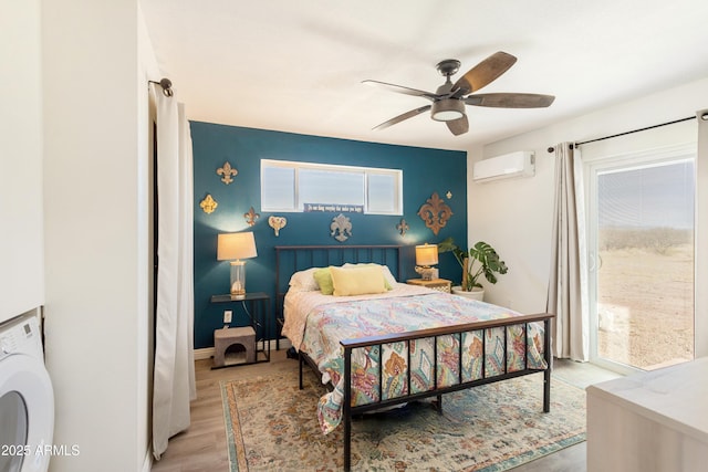 bedroom featuring a wall mounted air conditioner, multiple windows, light hardwood / wood-style floors, and ceiling fan