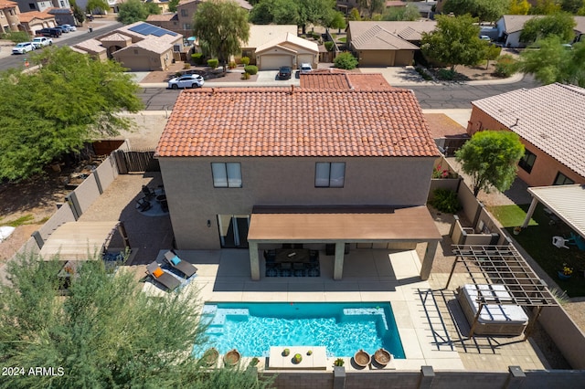 view of swimming pool featuring outdoor lounge area, an outdoor bar, and a patio area