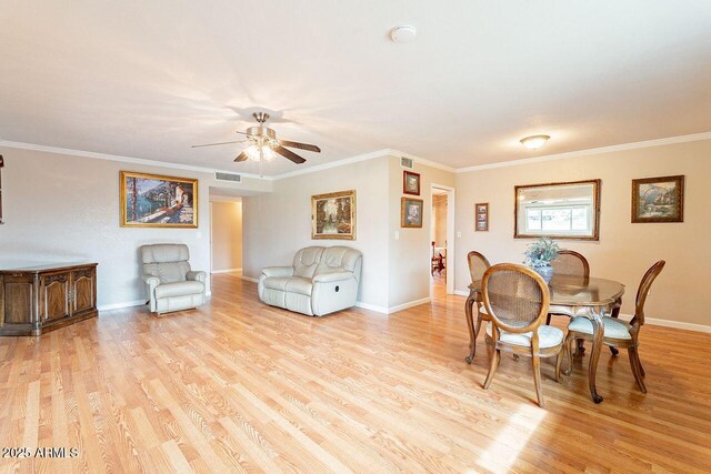 dining space featuring crown molding, ceiling fan, and light hardwood / wood-style floors