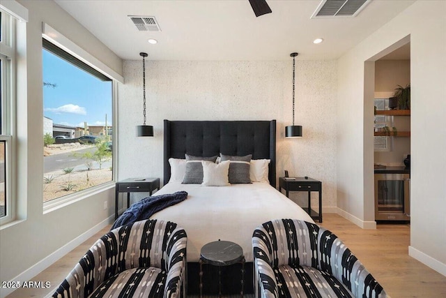 bedroom with light wood-type flooring, baseboards, visible vents, and recessed lighting