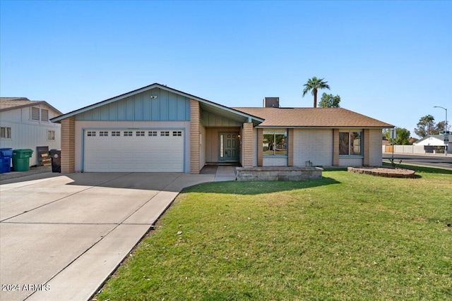 ranch-style house with a garage and a front lawn