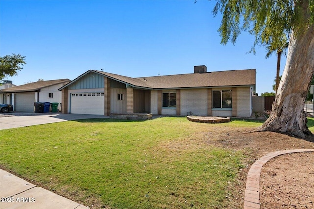 ranch-style home with a garage, board and batten siding, a front yard, and concrete driveway