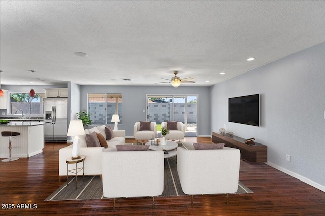 empty room with carpet floors, baseboards, and ceiling fan