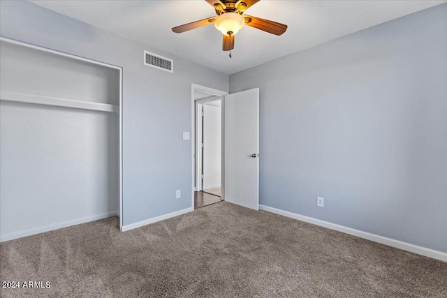 unfurnished bedroom featuring a closet, carpet, and ceiling fan