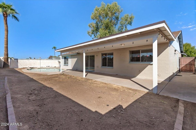 rear view of house with a patio