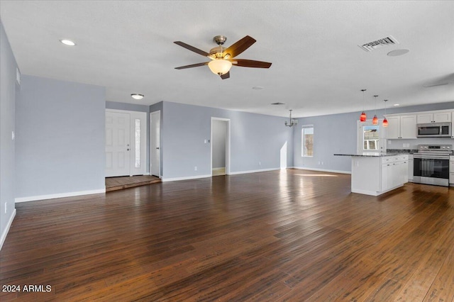 unfurnished living room featuring ceiling fan and dark wood-type flooring