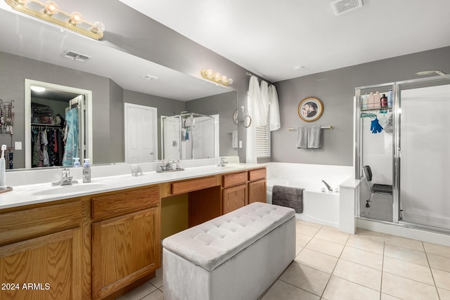 bathroom with vanity, tile patterned floors, and independent shower and bath