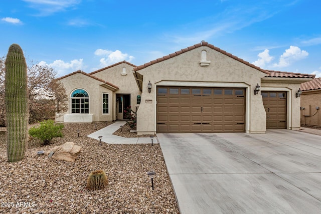 3677 N Hudson Dr, Florence, AZ 85132 - mediterranean / spanish-style home featuring a garage