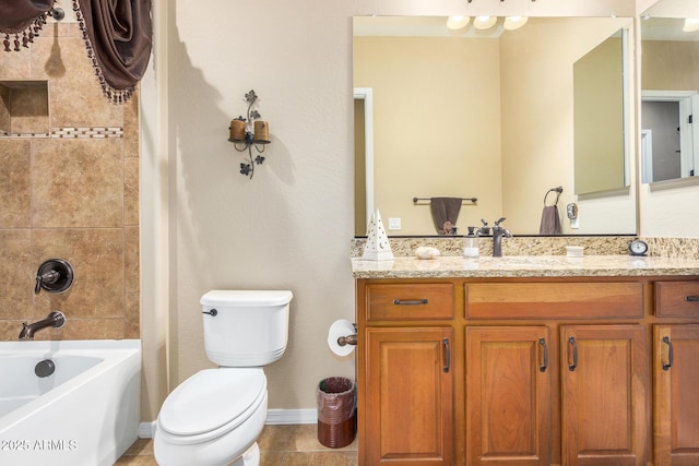 bathroom featuring toilet, vanity, and tile patterned floors