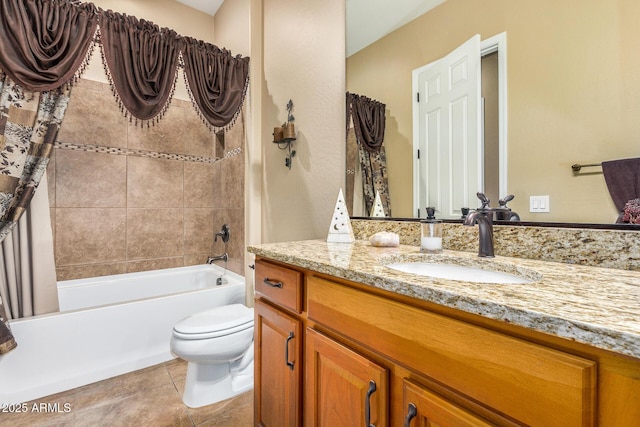 full bathroom featuring toilet, vanity, tile patterned floors, and shower / bath combo