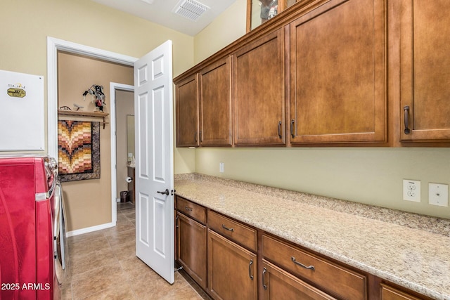 kitchen featuring light stone countertops