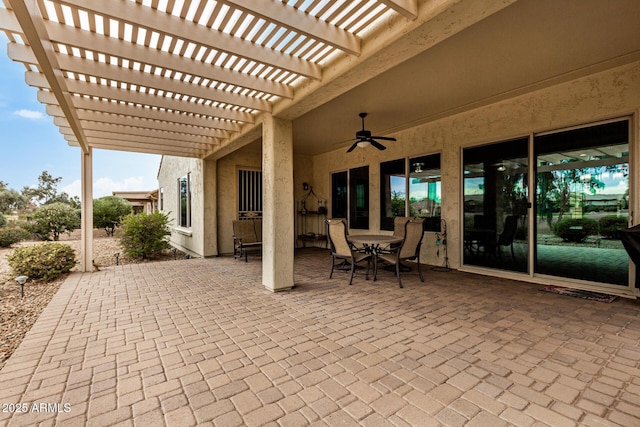 view of patio / terrace featuring ceiling fan and a pergola