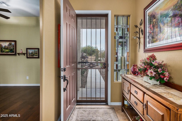 entryway featuring ceiling fan and hardwood / wood-style flooring