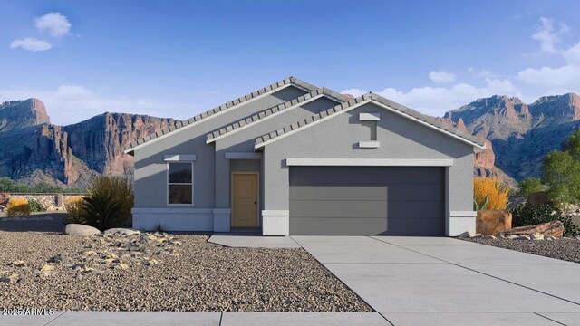 5457 E Mearn Rd, San Tan Valley, AZ 85140 - view of front of home featuring an attached garage, a mountain view, concrete driveway, and stucco siding