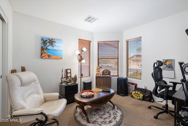 carpeted home office featuring visible vents