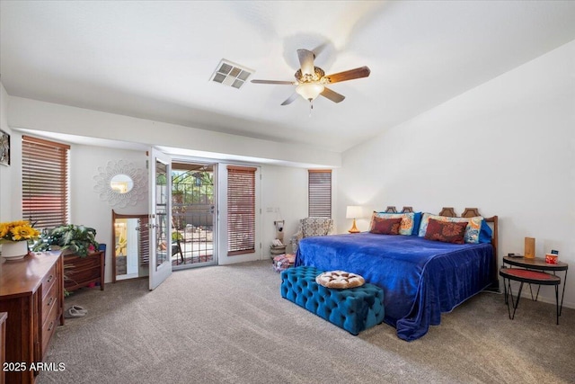 carpeted bedroom with visible vents, a ceiling fan, and access to outside