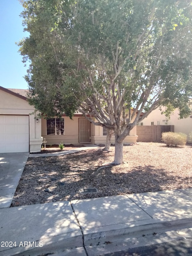 obstructed view of property featuring a garage