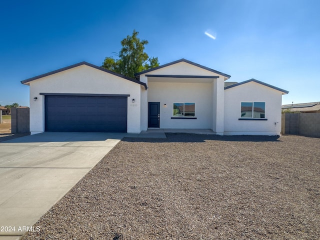 single story home featuring a garage