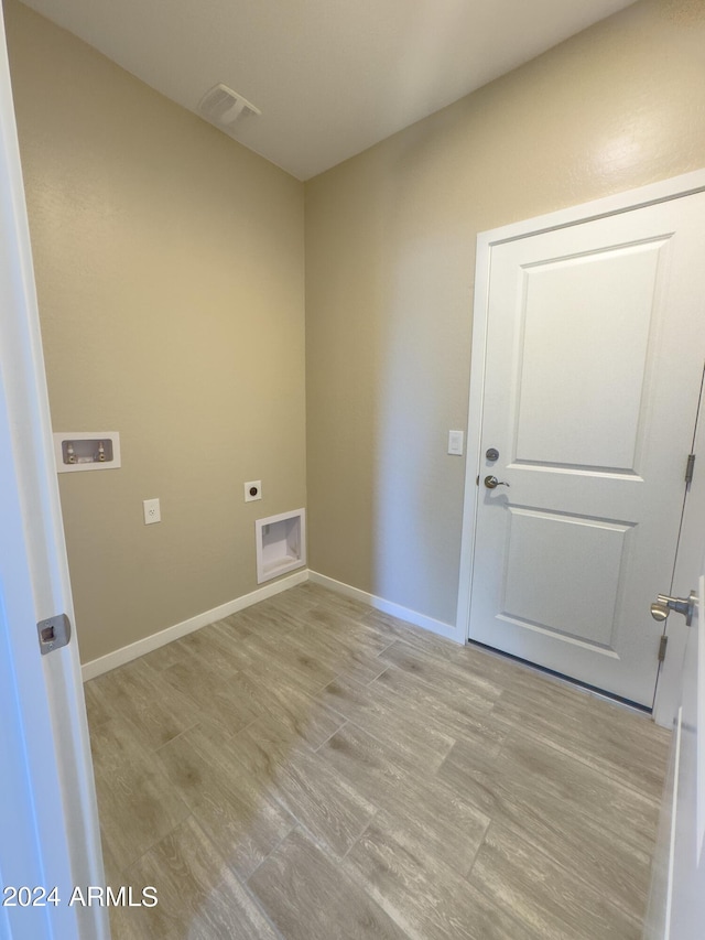 empty room with light hardwood / wood-style floors