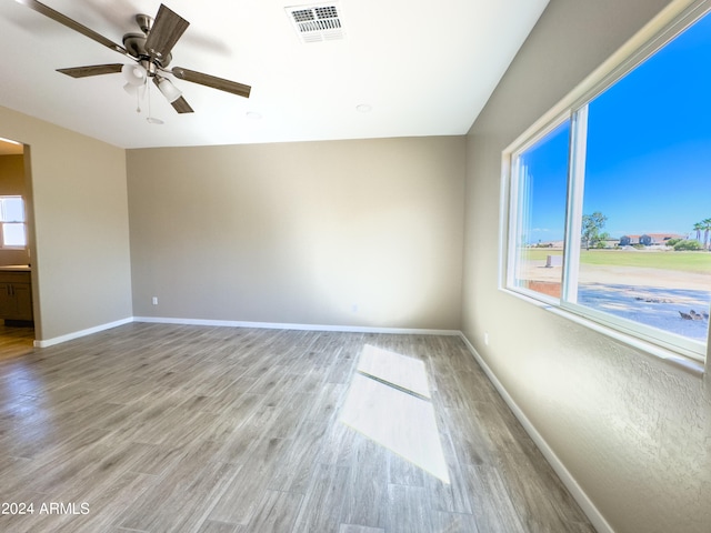 unfurnished room featuring ceiling fan and light hardwood / wood-style floors