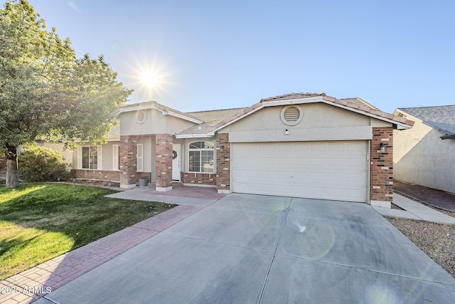 ranch-style home with a garage and a front lawn