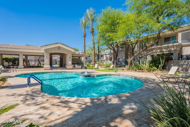 8180 E Shea Blvd Unit 1043, Scottsdale, AZ 85260 - community pool featuring a patio