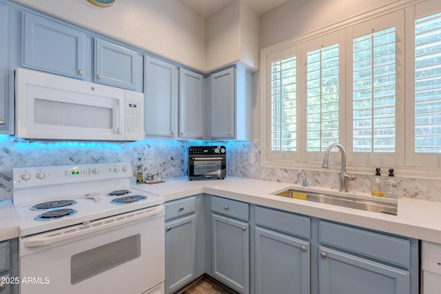 8180 E Shea Blvd Unit 1043, Scottsdale, AZ 85260 - kitchen with white appliances, decorative backsplash, and light countertops