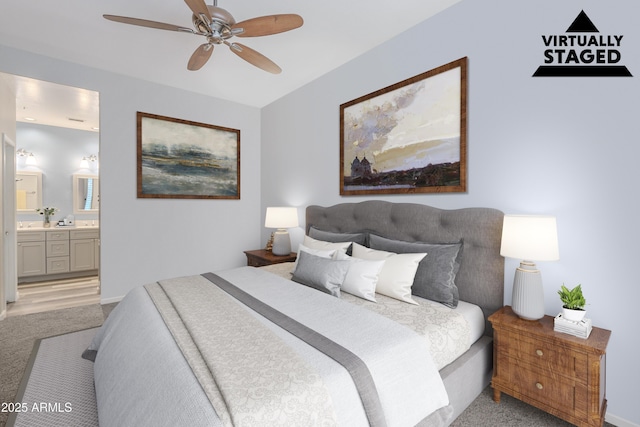 8180 E Shea Blvd Unit 1043, Scottsdale, AZ 85260 - bedroom featuring light colored carpet, connected bathroom, and a ceiling fan