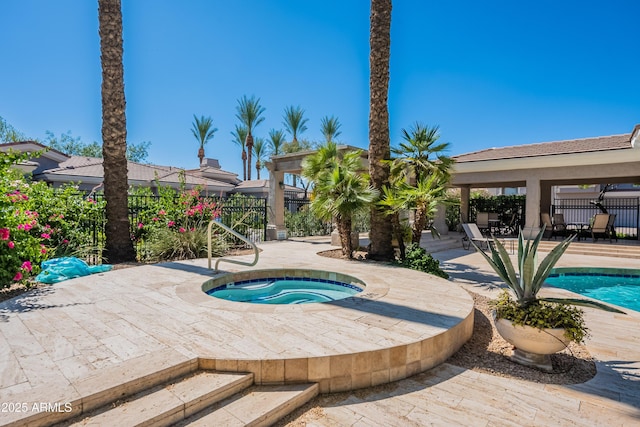 8180 E Shea Blvd Unit 1043, Scottsdale, AZ 85260 - view of swimming pool with an in-ground hot tub and a patio area