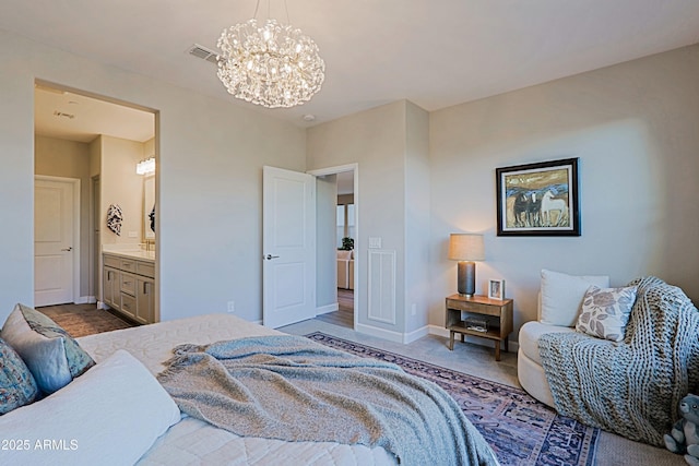 carpeted bedroom with ensuite bath, baseboards, visible vents, and a notable chandelier