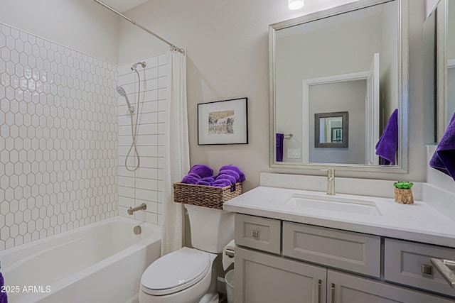 full bathroom with shower / tub combo, vanity, and toilet