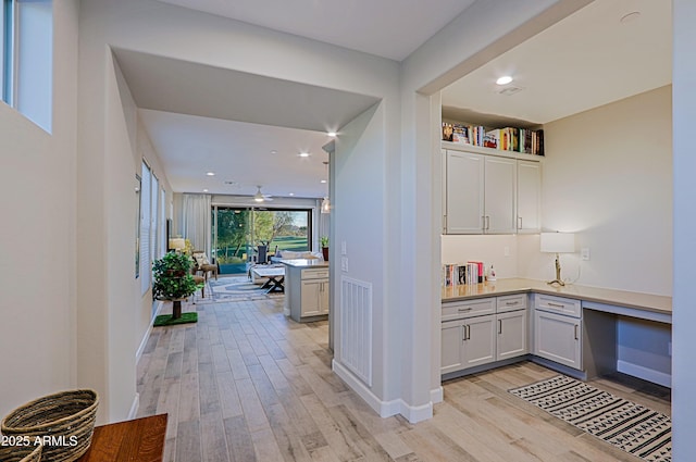 interior space featuring recessed lighting, visible vents, light wood-style flooring, and baseboards