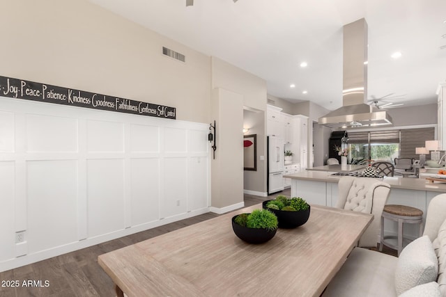 dining area featuring recessed lighting, visible vents, and wood finished floors