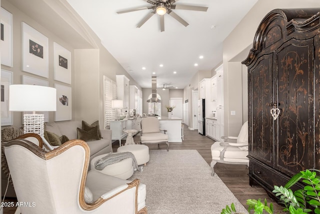 living room with recessed lighting, dark wood-style flooring, and ceiling fan