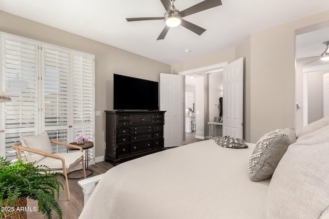 bedroom featuring baseboards, a ceiling fan, and wood finished floors