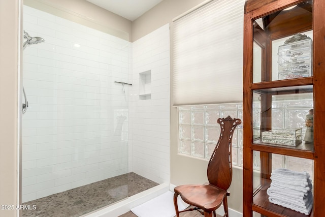 bathroom featuring tiled shower